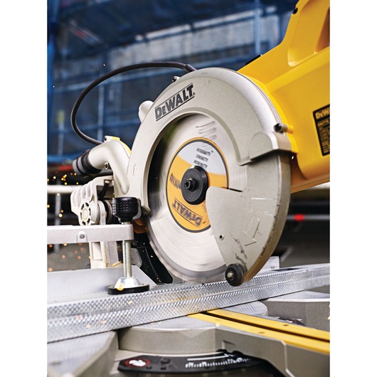 DEWALT circular saw cutting metal. Close-up view shows blade and sparks during operation.