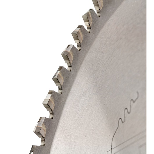 Close-up of a DEWALT circular saw blade showing sharp teeth and metal surface detail.