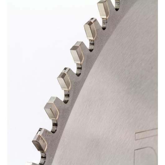 Close-up of metal saw blade teeth with sharp edges on a white background.