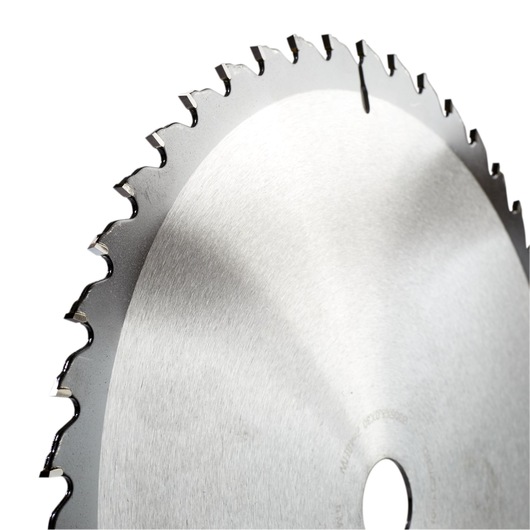 Close-up of a circular saw blade with sharp teeth and a central hole, photographed against a white background.