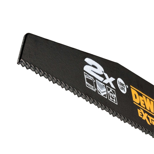Close-up of a DEWALT saw blade with teeth and printed icons for durability and material compatibility.