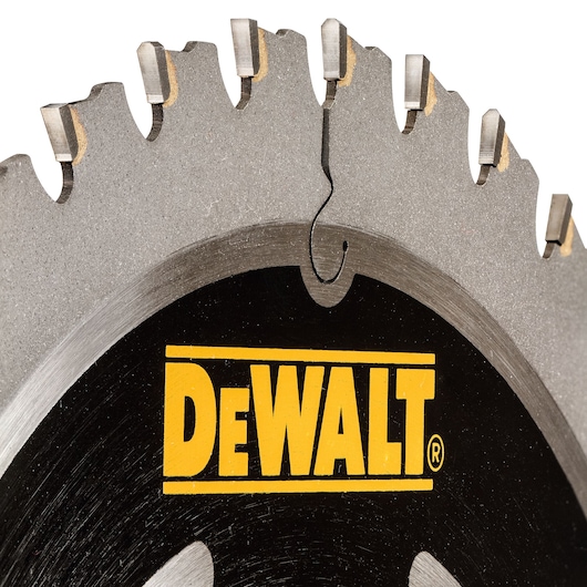 Close-up of a DEWALT circular saw blade with visible teeth and the yellow brand logo.