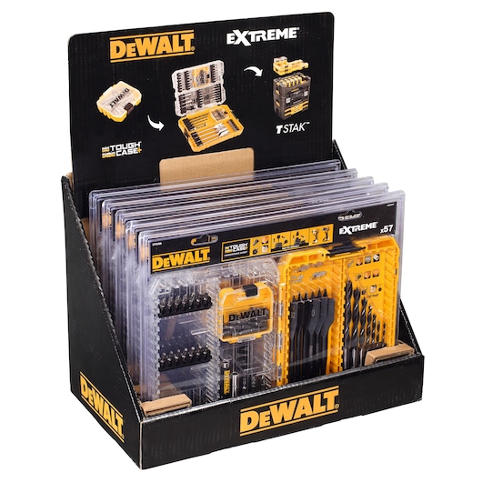 A DEWALT retail display box containing several DEWALT Extreme drill and screwdriver bit sets, organized in clear plastic cases with yellow accents. The display branding highlights 'Tough Case+' and 'TSTAK' compatibility.