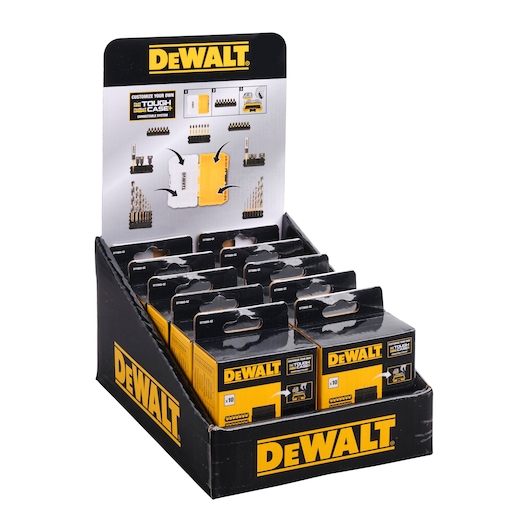 Display box of DEWALT Tough Case accessory sets with multiple small black and yellow packages arranged inside. The display features DEWALT branding and promotional images showing drill bits and related accessories.