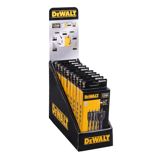 A display stand holding multiple packs of DEWALT XTREME flat wood drill bit sets. The stand is black and yellow with prominent DEWALT branding, and each package shows three drill bits of different sizes.