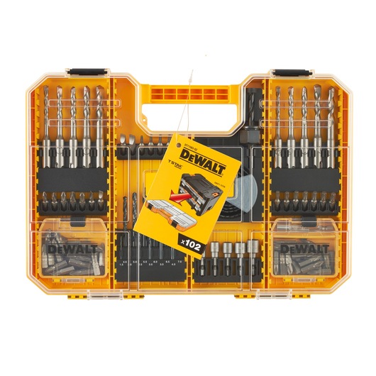 A DEWALT DT71583 yellow tool kit case with a transparent lid, containing various drill bits, screwdriver bits, and accessories, organized in compartments. A yellow DEWALT product information card is placed inside the case, indicating a 102-piece set.