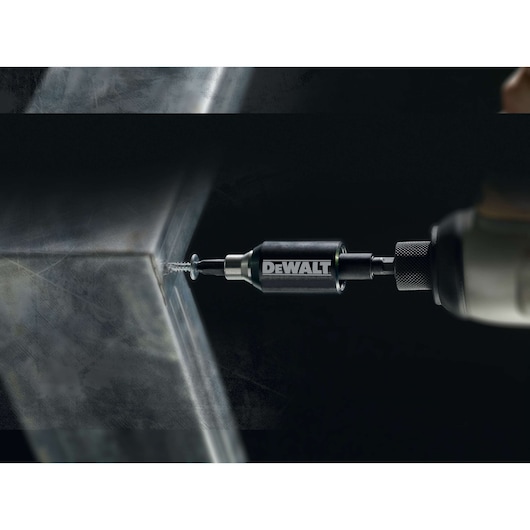 DEWALT DT7513T drill bit driving a screw into metal with a power tool.