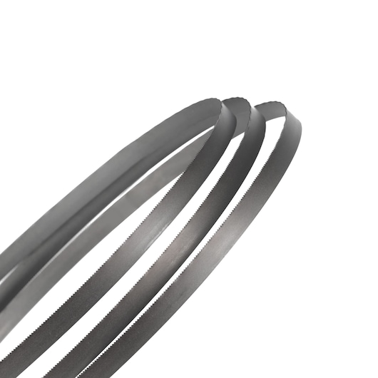 Close-up of three coiled metal bandsaw blades with fine teeth, shown against a white background.