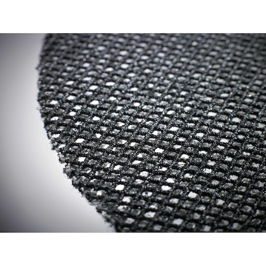 Close-up view of a DEWALT mesh sanding disc showing its woven texture and evenly spaced holes.