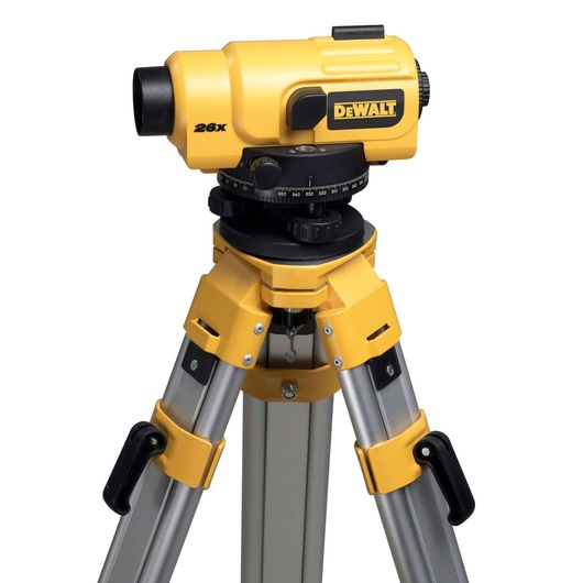 DEWALT DW096PK yellow optical level on a metal tripod, used for surveying and measuring in photography or construction.
