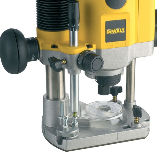 Close-up of a DEWALT DW621 plunge router, showing its yellow and silver body, adjustment knobs, and transparent base plate for woodworking applications.
