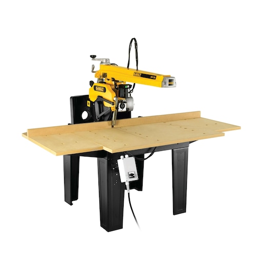DEWALT DW729KN radial arm saw on a sturdy black base with a large wooden work surface and electric control box.