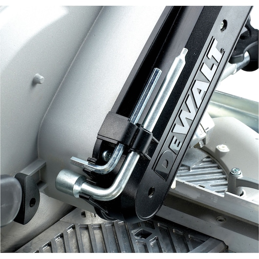 Close-up of DEWALT DW743N saw showing branded metal part and detailed mechanical components.