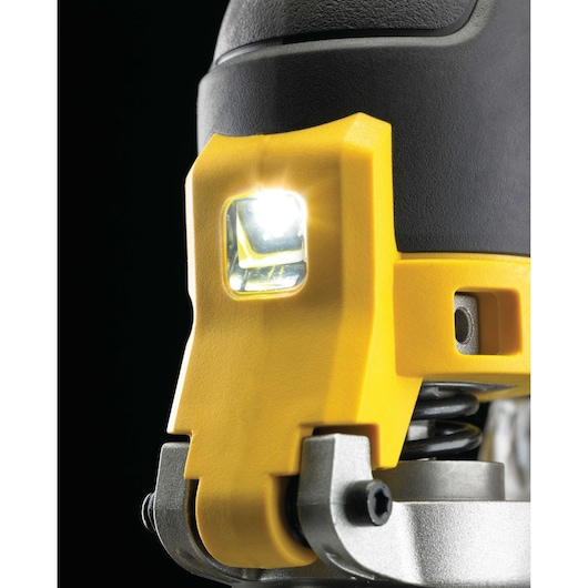 Close-up view of the LED light on a DEWALT power tool, showing the yellow casing and metallic parts.