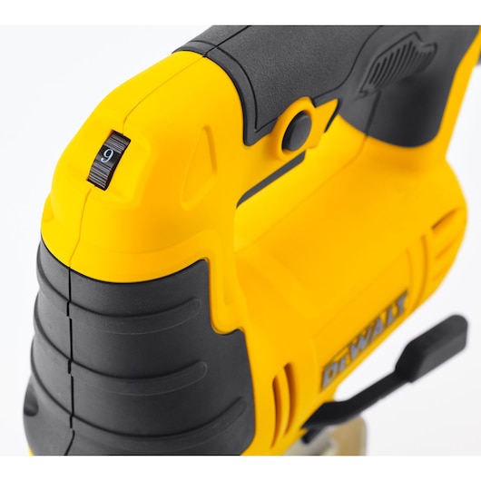 Close-up view of a yellow and black DEWALT jigsaw handle, showing the grip and a numbered dial on the tool.
