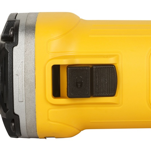 Close-up view of the yellow body of a DEWALT DWE4884 power tool, showing its black switch with a lock symbol.