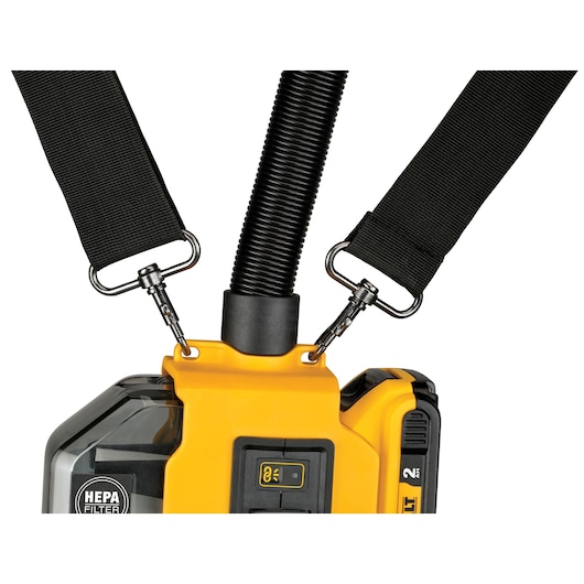 Close-up of DEWALT portable dust extractor with HEPA filter, carrying straps, and hose attachment.