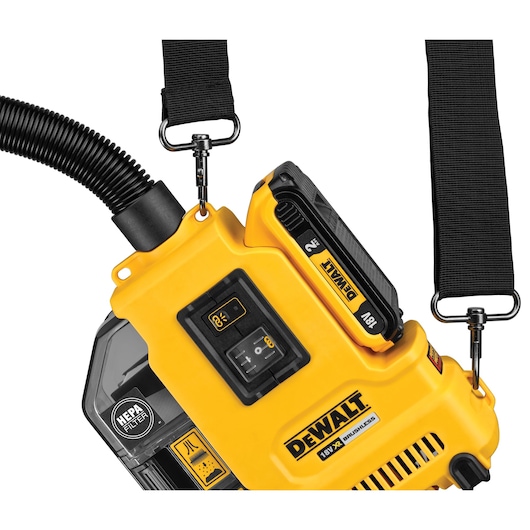Close-up of DEWALT DWH161D1 yellow portable vacuum with HEPA filter, battery, and black carrying strap.