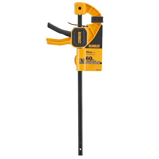 A DEWALT 30 cm trigger clamp with a black and yellow color scheme, featuring a handle and clamping mechanism for securing materials. The packaging highlights a 60 kg clamping force.
