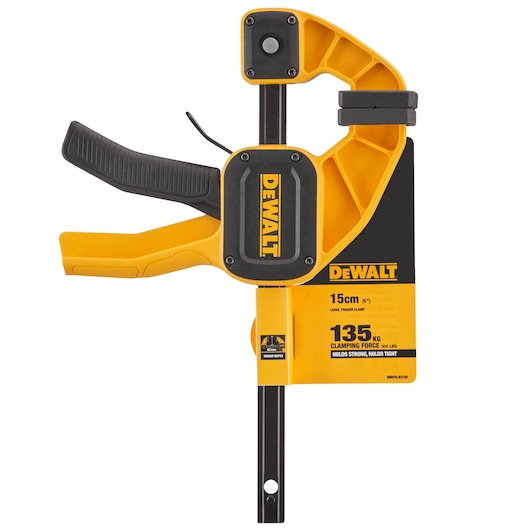 A DEWALT large trigger clamp, model DWHT0-83192, shown in yellow and black. The clamp is marked with specifications: 15cm (6 inches) clamping width, 135kg (300 lbs) clamping force. The tool features a comfortable handle and sturdy construction.