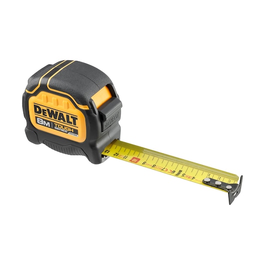 DEWALT 8M Tough Series tape measure with yellow blade, black and yellow casing, extended for measurement.