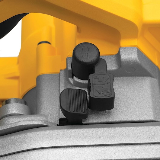 Close-up view of control buttons and locking mechanism on a DEWALT power tool, featuring yellow and gray components.