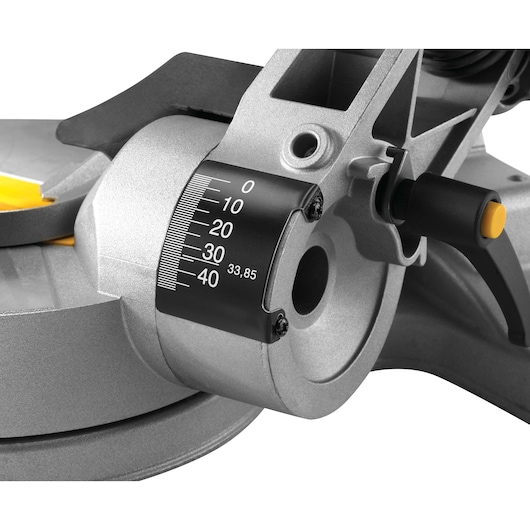 Close-up of a DEWALT DWS778 angle gauge and adjustment lever on a mitre saw.