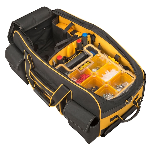 DEWALT tool bag open showing organizer compartments and assorted hardware inside.
