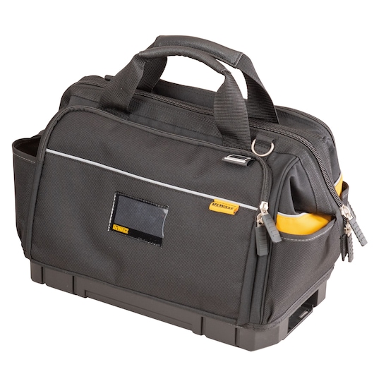 Black DEWALT tool bag with handles, zippered compartments, and side pockets on a sturdy base.