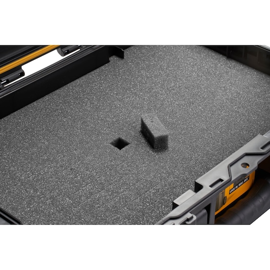 Close-up of a DEWALT case with modular foam insert for customizable storage protection.