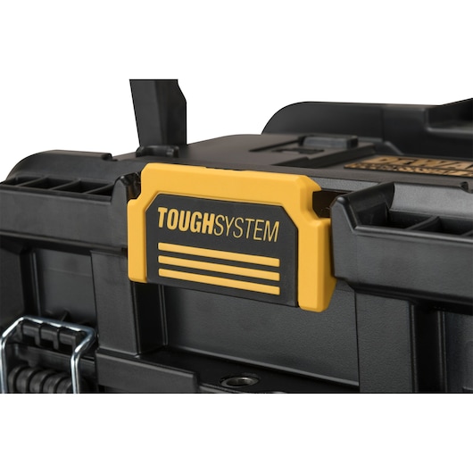 Close-up of a DEWALT ToughSystem plastic tool case with yellow and black latch detail.