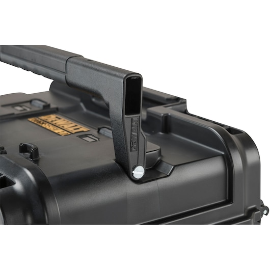 Close-up of a DEWALT black plastic toolbox handle and corner detail.