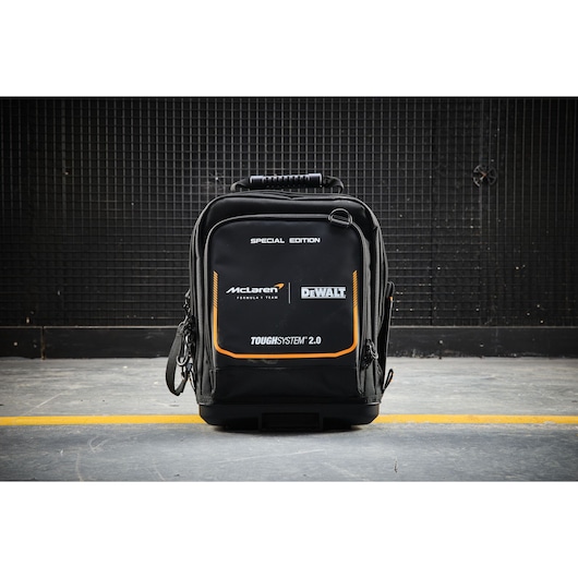 DEWALT ToughSystem 2.0 special edition black tool backpack with McLaren branding on concrete floor.
