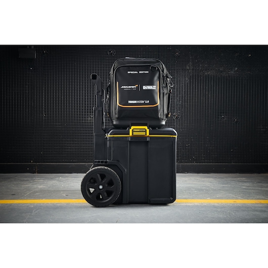 DEWALT ToughSystem 2.0 storage kit with backpack and wheeled toolbox, special edition, on an industrial floor.