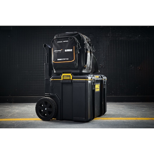DEWALT ToughSystem 2.0 wheeled toolboxes stacked with a black special edition backpack on top.