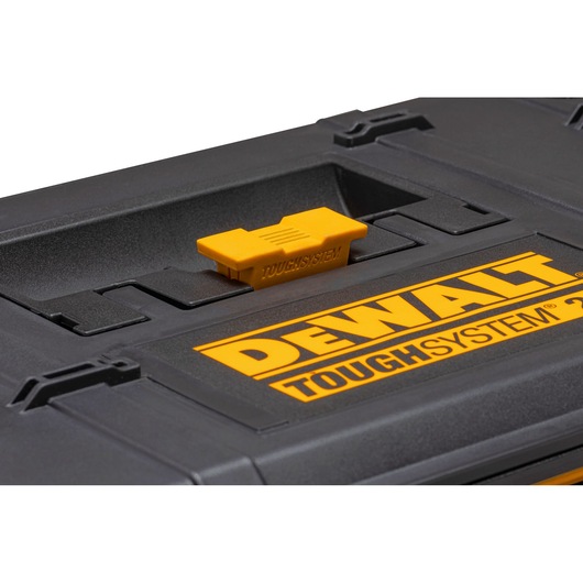 Close-up of a DEWALT ToughSystem 2.0 black storage case with yellow latch and branding.